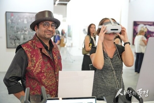 Art enthusiasts explore digital exhibitions of the CGTN Art Series at ART SG in Singapore, January 23, 2026. /CGTN